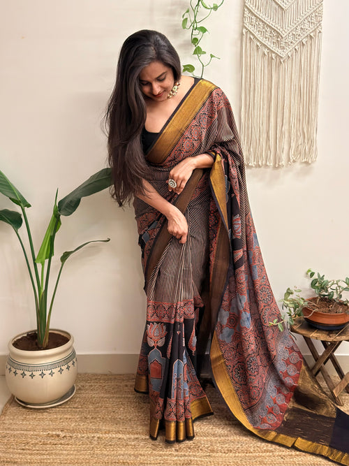 Adaa: Black Ajrakh Handblock Printed Mul Cotton Saree with Zari Border
