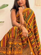 Basant: Turmeric Ajrakh Handblock Printed Mul Cotton Saree