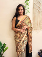 The Eclipse: Beige and Black Striped Ajrakh Handblock Printed Modal Saree