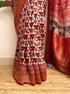 Dilruba: Cream and Red Ajrakh Handblock Printed Dola Silk Saree